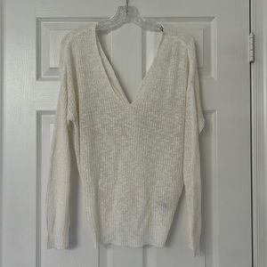 Sheer off-white open back sweater.